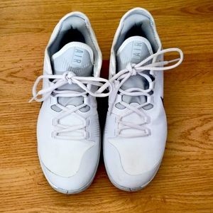White Nike Air tennis court shoes